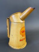 A Shell Motor Oil quart measure, dated 1952.