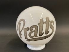 A small reproduction spherical glass globe with etched Pratts lettering.