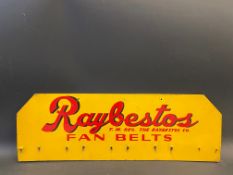 A Raybestos Fan Belts hardboard wall hanging rack advertising sign, 24 x 8".