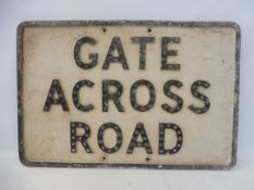 An aluminium road sign for 'Gate Across Road' with integral glass reflectors, 21 1/4 x 14 1/4".