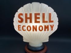 A Shell Economy glass petrol pump globe by Hailware, in good condition, fully stamped underneath.