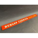 A Dunlop Carrier Cycle Tyres shelf strip.