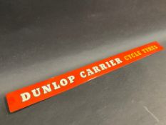 A Dunlop Carrier Cycle Tyres shelf strip.