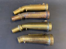 Four brass petrol can filler nozzles.