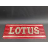A Lotus ribbed plastic hanging showroom window sign, 24 1/4 x 9".