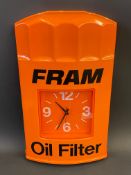 A Fram Oil Filter wall mounted battery operated clock, 15 1/2 x 24".