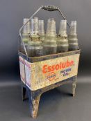 An Essolube eight division garage forecourt crate containing eight correct glass bottles, with