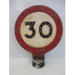 A small 30mph double sided post mounted speed limit reminder sign, with integral glass reflective