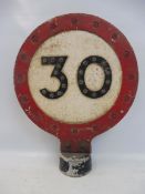 A small 30mph double sided post mounted speed limit reminder sign, with integral glass reflective