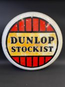 A Dunlop Stockist circular aluminium advertising sign, 36" diameter.