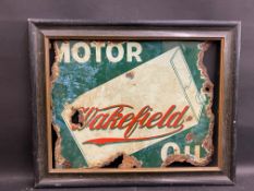 A rare and early Wakefield Motor Oil double sided enamel sign with an image of a can to both