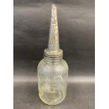 A Mobiloil 'A' grade American glass oil bottle with embossed conical lid.