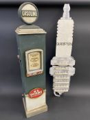 A wooden wall hanging rack in the shape of a Champion spark plug, plus a modern cabinet