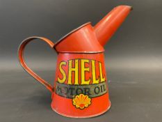 A Shell Motor Oil pint measure in good condition.