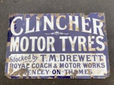 A large and very early Clincher Motor Tyres enamel sign bearing the words 'Stocked by T.M. Drewett