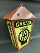 An AA Garage illuminated hanging lightbox, of tapering form, 23" w x 29" h (excluding hanging