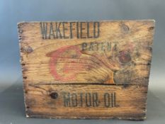 A Wakefield Castrol Motor Oil wooden delivery crate for six quart cans.