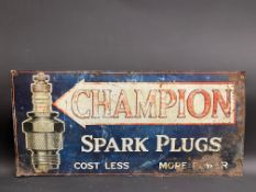 An early Champion Spark Plugs embossed and part pictorial tin advertising sign, 29 1/2x 14".