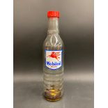 A Mobiloil glass quart oil bottle, unusually with the additional word 'Vacuum' to the label.