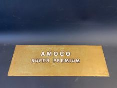An Amoco Super Premium glass petrol pump brand insert, broken and reglued 20 x 7".
