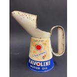 A Havoline Motor Oil pint measure.