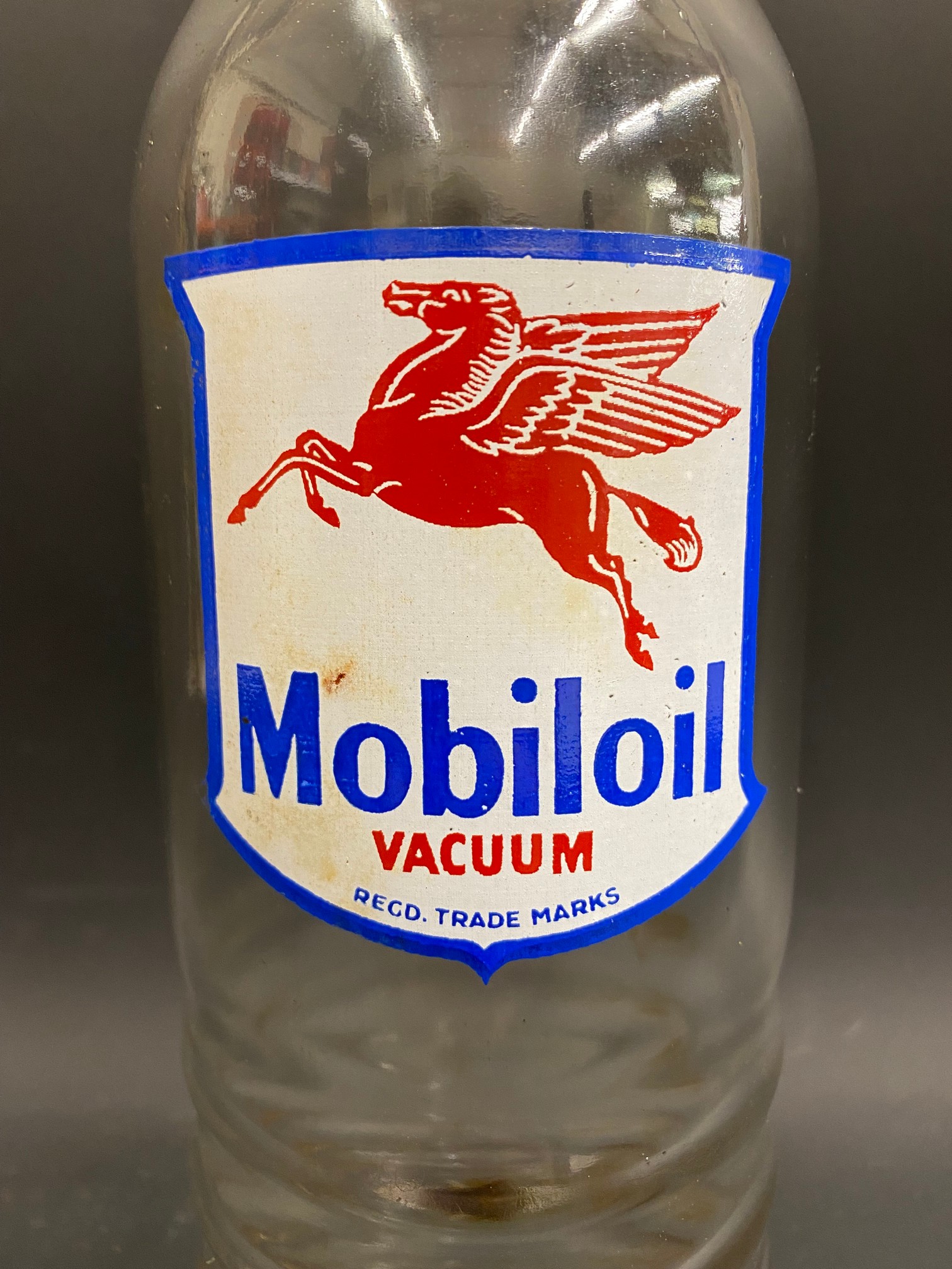 A Mobiloil glass quart oil bottle, unusually with the additional word 'Vacuum' to the label. - Image 2 of 3