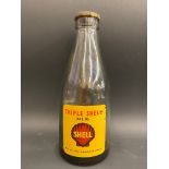 A Shell Triple Shell oil bottle.