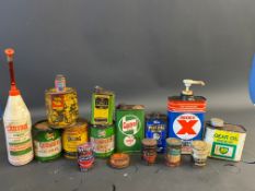 A selection of assorted grease and oil tins etc.