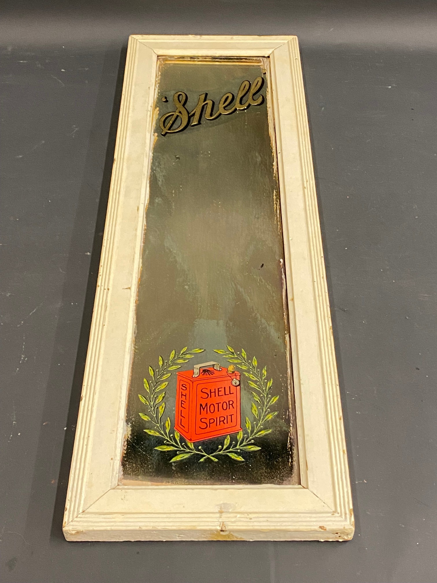 A Shell narrow advertising mirror with can within laurel wreath motif, original Forrest & Son