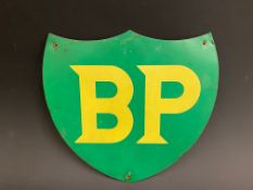 A BP shield shaped petrol pump tin brand indicating advertising sign, 10 x 9".