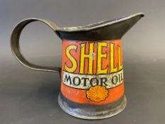 A Shell Motor Oil pint measure, early wide rim version dated 1929.