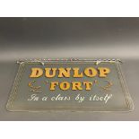 A Dunlop Fort glass showroom sign with reverse etched gilded letters, and hanging chain, 22 x 12".