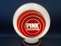 A Pink Paraffin glass petrol pump globe by Hailware, in good condition.