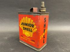 A Junior Shell lighter fluid tin.