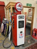 A Wayne 70 electric petrol pump, restored in Mobiloil livery, with a reproduction Mobiloil plastic