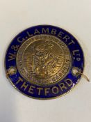 A blue enamel and nickel plated circular supply plate for W.& G. Lambert of Thetford.
