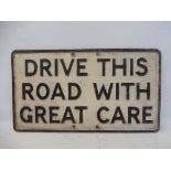 An aluminium road sign for 'Drive this road with great care', 27 x 15".