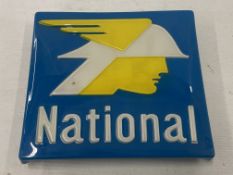 A National Benzole plastic petrol pump brand plaque, appears to be new old stock, 6 1/4 x 6".