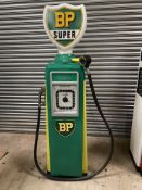 An Avery Hardoll 101 electric petrol pump, restored in BP livery, with a reproduction BP glass