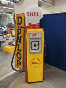 An Avery Hardoll 101 electric petrol pump, restored in Shell livery, with a reproduction Shell glass