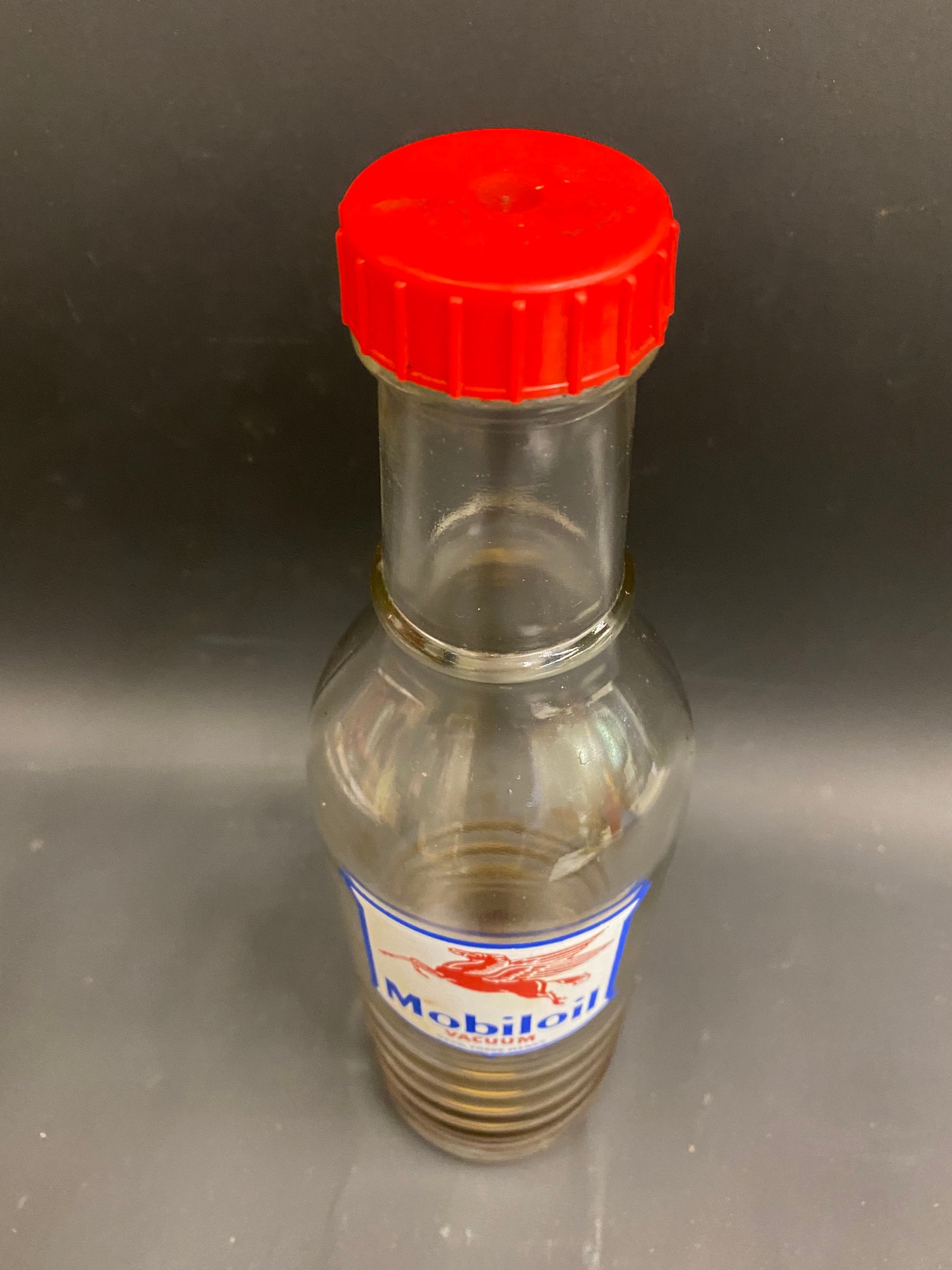 A Mobiloil glass quart oil bottle, unusually with the additional word 'Vacuum' to the label. - Image 3 of 3