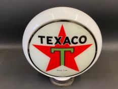 An American older reproduction Texaco petrol pump globe, with metal collar.