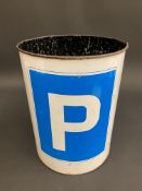 A cylindrical waste paper bin with decoration depicting road signs.