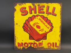 A Shell Motor Oil enamel sign with central dripping can image against a clam motif, 18 x 18".