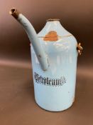 A large blue enamel petrol priming kettle, marked 'Petroleum' to the front.