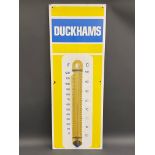 A Duckhams enamel thermometer by Burnham of London in excellent condition, with the original