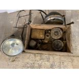 A box of assorted motorcycle parts including two Lucas headlamps, horns, and