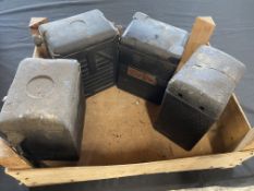 Four early motorcycle battery casings including Exide.