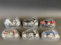 Six good quality scale models of Harley Davidson motorcycles by Maesto (in plastic packs).