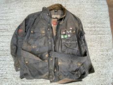 A Belstaff Trialmaster wax jacket and liner, with some enamel badges attached including Woburn